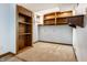 Spacious unfinished basement area with carpeting and built-in shelving units for storage at 4644 Cornelius Ave, Indianapolis, IN 46208