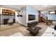 Staged basement featuring carpet, entertainment center, sofa, and decorative office space at 4644 Cornelius Ave, Indianapolis, IN 46208