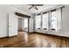 Spacious bedroom featuring white walls, hardwood floors, a ceiling fan and plenty of natural light at 4644 Cornelius Ave, Indianapolis, IN 46208