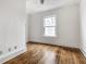 Charming bedroom featuring hardwood floors, vintage ceiling, and natural light at 4644 Cornelius Ave, Indianapolis, IN 46208