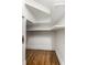 Walk-in closet with custom shelving and hardwood floors for ample storage space at 4644 Cornelius Ave, Indianapolis, IN 46208