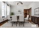 Bright dining room featuring a ceiling fan and a dark wood table set on a neutral area rug at 4644 Cornelius Ave, Indianapolis, IN 46208