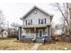 Charming two-story home with blue shutters, covered front porch, and inviting curb appeal at 4644 Cornelius Ave, Indianapolis, IN 46208
