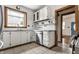 Well-lit kitchen featuring white cabinets, butcher block countertops, stainless steel appliances and a garden window at 4644 Cornelius Ave, Indianapolis, IN 46208