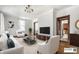 Virtual staging of a spacious living room featuring modern furniture and decorative ceiling at 4644 Cornelius Ave, Indianapolis, IN 46208