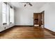 Bright living room with hardwood floors and natural light, seamlessly connecting to another room at 4644 Cornelius Ave, Indianapolis, IN 46208