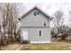Two story house with gray siding, white door, and a chain link fence at 4644 Cornelius Ave, Indianapolis, IN 46208