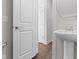 Stylish bathroom features a pedestal sink, modern fixtures and bright neutral walls at 517 Steinbeck Pl, Carmel, IN 46032
