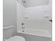 Bright bathroom showcasing a bathtub with white tiling at 517 Steinbeck Pl, Carmel, IN 46032