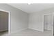 Neutral bedroom with white trim, carpet, and a door leading to the walk-in closet at 517 Steinbeck Pl, Carmel, IN 46032