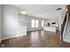 Open-concept living space with hardwood floors and seamless flow to a modern kitchen at 517 Steinbeck Pl, Carmel, IN 46032