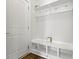 Organized mudroom featuring coat hooks, storage cubbies and white trim throughout at 517 Steinbeck Pl, Carmel, IN 46032