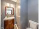Bathroom features wood vanity with sink and a toilet at 556 Gibson Dr, Westfield, IN 46074