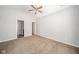 An empty bedroom with a ceiling fan and access to ensuite bathroom at 556 Gibson Dr, Westfield, IN 46074