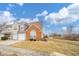 Charming townhouse with an attached garage, landscaping, and a well-manicured lawn at 556 Gibson Dr, Westfield, IN 46074