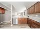 A kitchen with stainless steel dishwasher, and wood cabinets at 556 Gibson Dr, Westfield, IN 46074