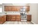 A modern kitchen features stainless steel oven and microwave and hardwood cabinets at 556 Gibson Dr, Westfield, IN 46074