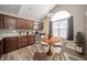 Eat-in kitchen featuring dark cabinets, stainless steel appliances, and a cozy dining area at 556 Gibson Dr, Westfield, IN 46074