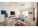 Open living room featuring vaulted ceilings, ceiling fan, and neutral decor at 556 Gibson Dr, Westfield, IN 46074