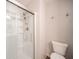 Bathroom includes shower with a glass door and a toilet at 556 Gibson Dr, Westfield, IN 46074