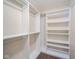 Organized walk-in closet with shelving and clothing rods offer optimal storage at 556 Gibson Dr, Westfield, IN 46074