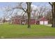 Inviting single-story home with a covered front porch and a detached garage at 5902 Hardegan St, Indianapolis, IN 46227