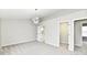 Spacious bedroom with neutral paint, carpet, and a modern light fixture at 6251 Kelsey Dr, Indianapolis, IN 46268