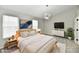 Stylish bedroom featuring a vaulted ceiling, carpet, modern furniture and a contemporary light fixture at 6251 Kelsey Dr, Indianapolis, IN 46268