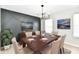 Staged dining room featuring modern wall paneling, wood table, and sophisticated decor at 6251 Kelsey Dr, Indianapolis, IN 46268