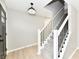 Bright entry hallway with a staircase, modern lighting, and neutral decor at 6251 Kelsey Dr, Indianapolis, IN 46268
