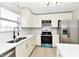 Well-appointed kitchen with white cabinets, modern appliances, and ample counter space at 6251 Kelsey Dr, Indianapolis, IN 46268