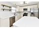 Bright kitchen with stainless steel appliances, modern fixtures, and quartz countertops at 6251 Kelsey Dr, Indianapolis, IN 46268