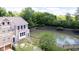 Aerial view of the home near a pond with trees and a beautiful landscape at 651 Greenford N Trl, Carmel, IN 46032