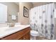 Bright bathroom with a white shower curtain, clean sink, and modern fixtures at 651 Greenford N Trl, Carmel, IN 46032