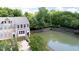 Charming townhome with a private balcony overlooking a tranquil pond surrounded by lush greenery at 651 Greenford N Trl, Carmel, IN 46032