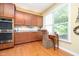 Bright, modern kitchen with stainless steel appliances and hardwood floors at 651 Greenford N Trl, Carmel, IN 46032