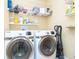 Well-organized laundry room with modern machines and ample shelving for storage solutions at 651 Greenford N Trl, Carmel, IN 46032