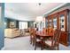 Open-concept living space with a dining area and a comfortable living room with built-in shelving at 651 Greenford N Trl, Carmel, IN 46032