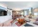 Open living space showcasing a living room with built-ins and a dining area with hardwood floors at 651 Greenford N Trl, Carmel, IN 46032