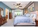 Comfortable main bedroom with a ceiling fan, a sitting area, and an ensuite bathroom at 651 Greenford N Trl, Carmel, IN 46032