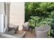 Outdoor patio featuring wicker seating and a view of the surrounding greenery at 651 Greenford N Trl, Carmel, IN 46032