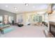 Spacious room with large windows, fireplace, and equipment for exercising at 651 Greenford N Trl, Carmel, IN 46032