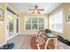 Bright sun room filled with natural light and cozy Pilates chairs for comfortable relaxing at 651 Greenford N Trl, Carmel, IN 46032