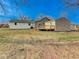 The home features a large, grassy backyard with a deck at 6780 N Michigan Rd, Fairland, IN 46126