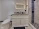 Bathroom with a granite vanity, lighted mirror, toilet and modern walk-in shower at 6780 N Michigan Rd, Fairland, IN 46126