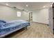 Spacious bedroom featuring laminate flooring, neutral walls, and ample natural light at 6780 N Michigan Rd, Fairland, IN 46126