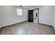 Well-lit bedroom with wood floors, black door and trim, and bright natural light at 6780 N Michigan Rd, Fairland, IN 46126
