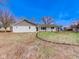 Charming one-story home with a white brick exterior, covered porch, and a well-manicured lawn at 6780 N Michigan Rd, Fairland, IN 46126