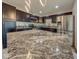Modern kitchen with stainless steel appliances, granite countertops, and dark wood cabinets at 6780 N Michigan Rd, Fairland, IN 46126