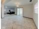 Bright living room with tile floors, sliding glass doors, and contemporary lighting fixtures at 6780 N Michigan Rd, Fairland, IN 46126